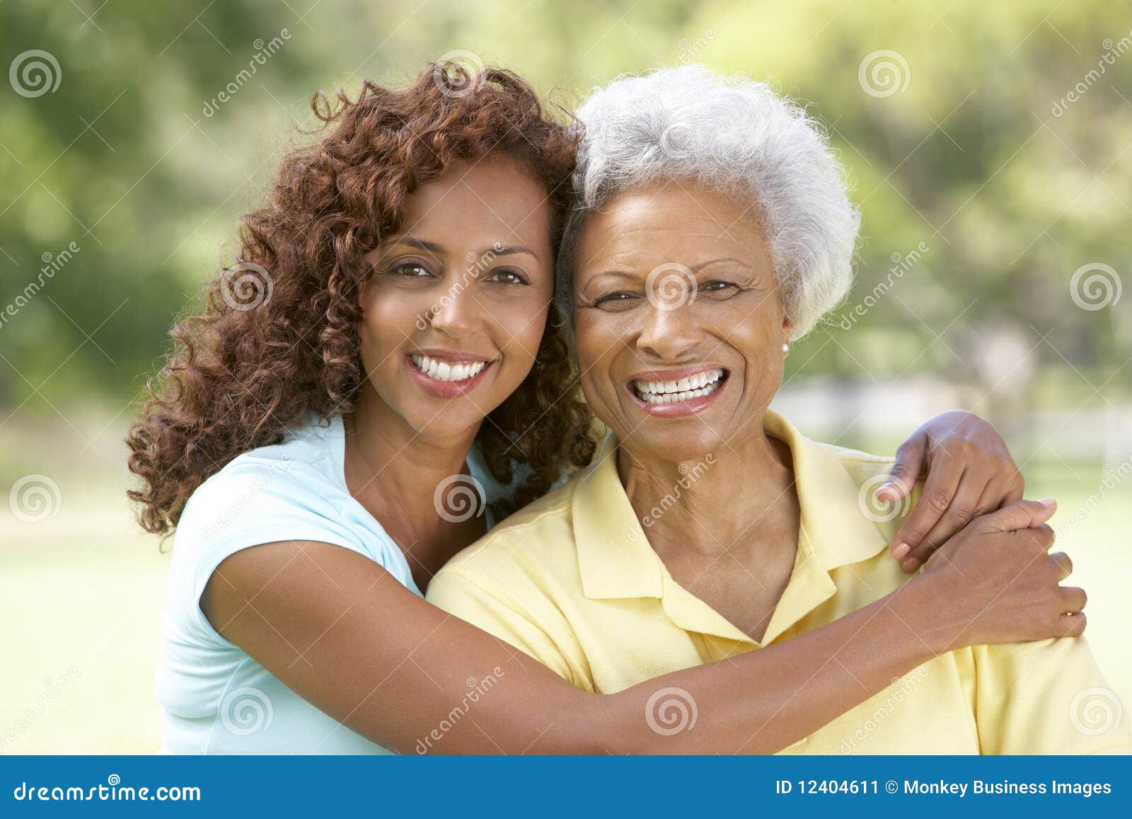 senior woman with adult daughter in park