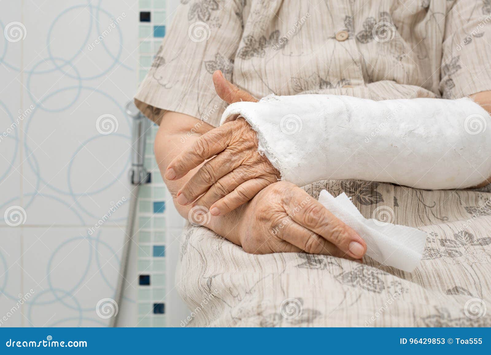 Senior Woman with Broken Arm Using the Toilet Stock Image Image of