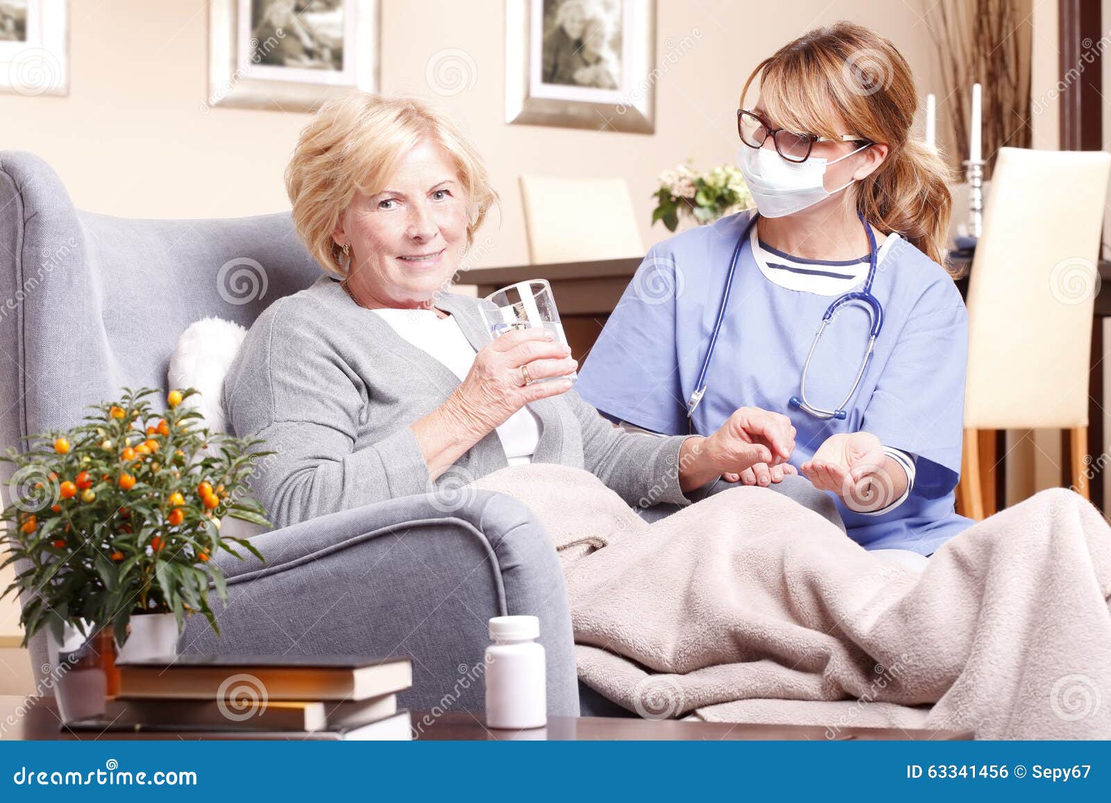 senior woman and caregiver at home