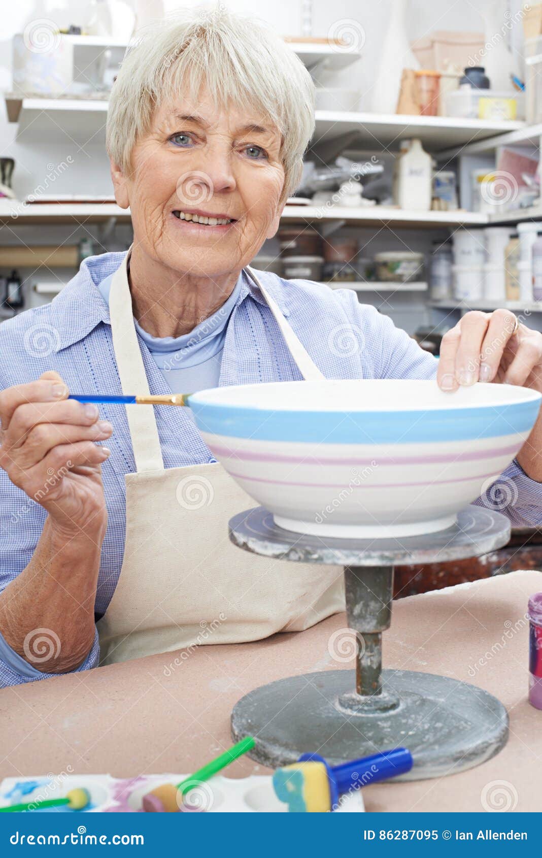 Senior Woman Decorating Bowl in Pottery Class Stock Image Image of