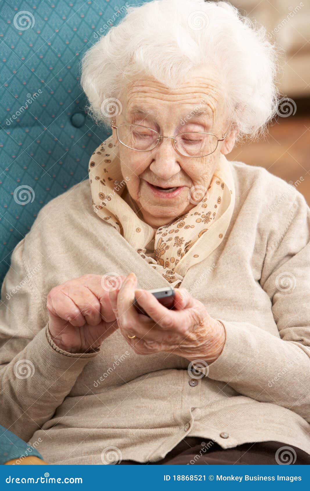 senior woman dialling number on mobile phone