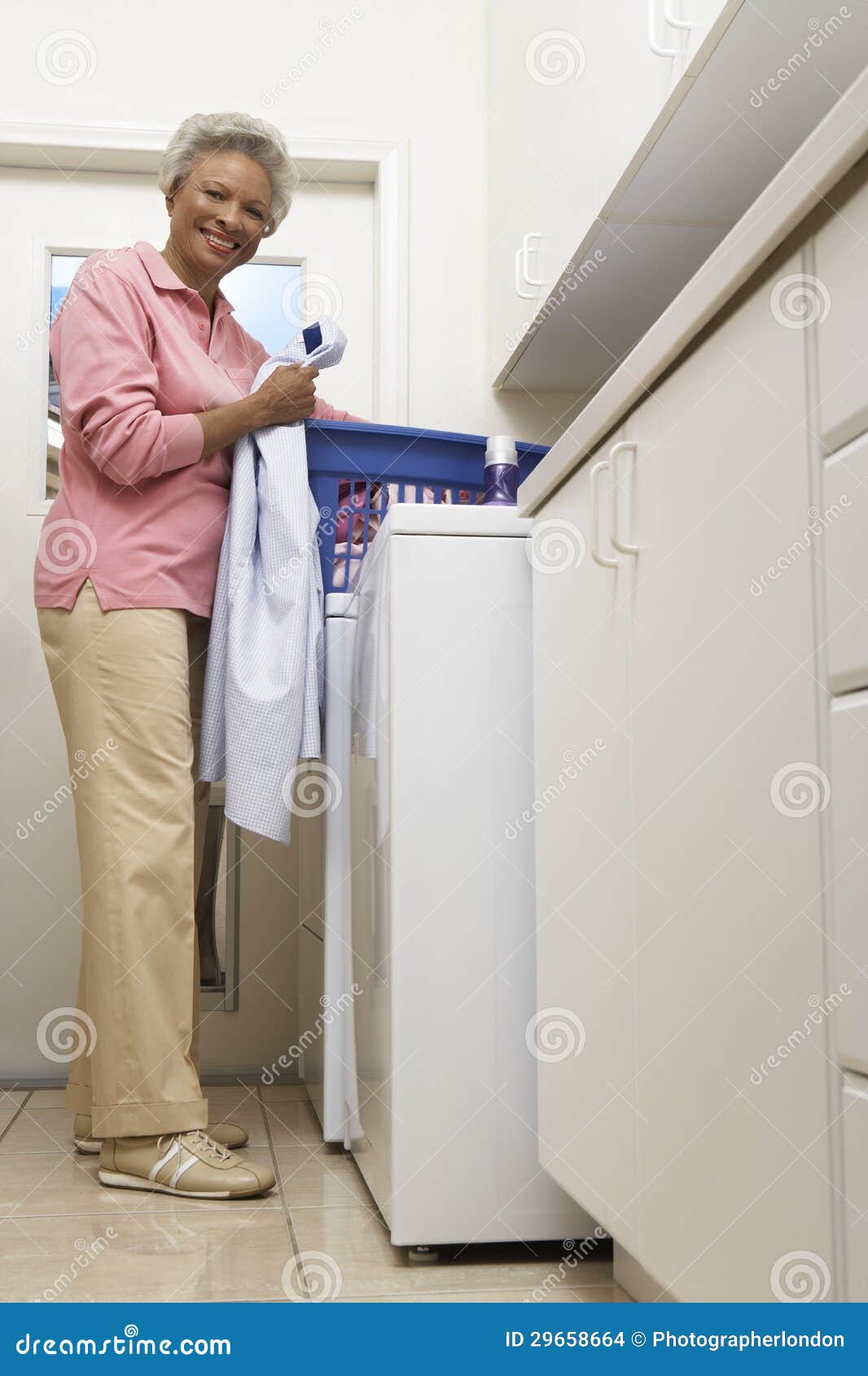 Senior Woman Doing Laundry at Home Stock Photo Image of indoors