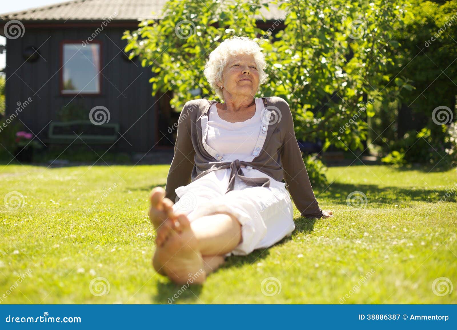 Senior Woman Enjoying The Fresh Air In Garden Stock Photo - Image: 38886387