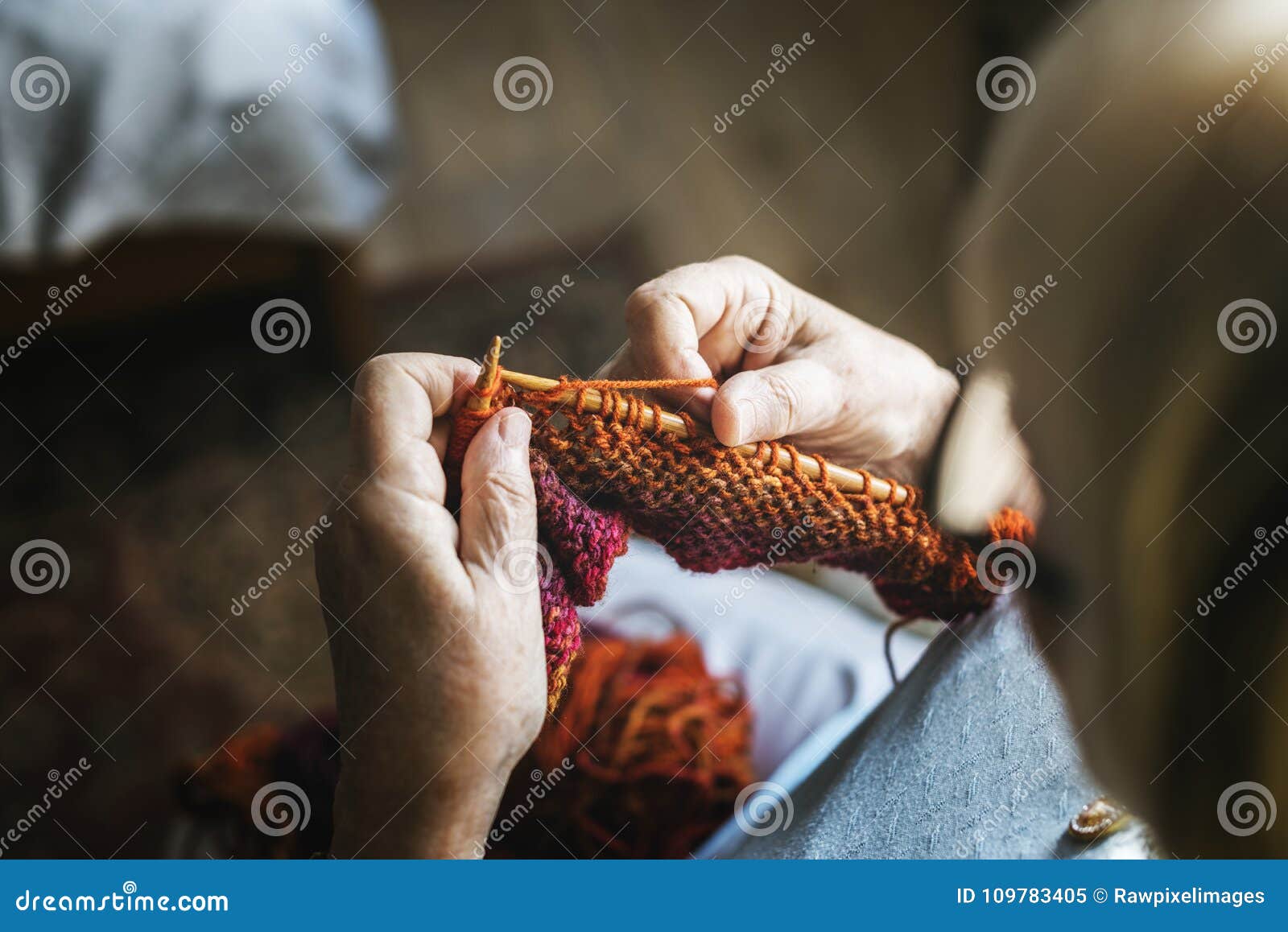 senior woman knitting for hobby at home
