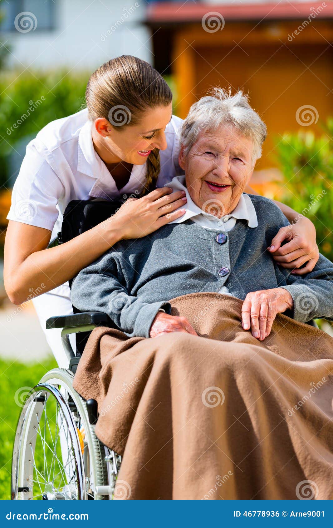 senior woman in nursing home with nurse in garden