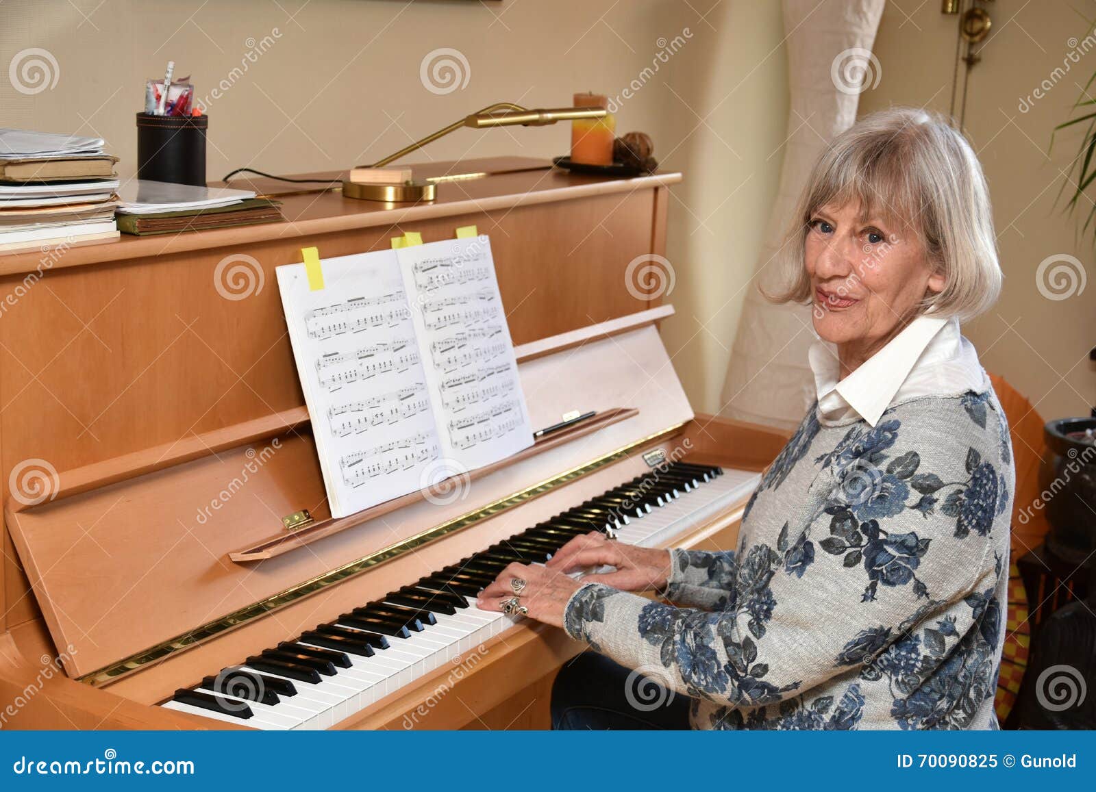 senior woman plays piano