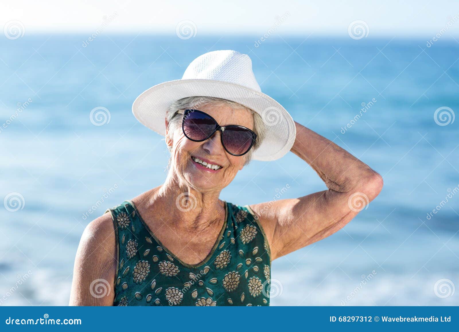 Senior Woman Posing with Sunhat Stock Photo - Image of smiling ...