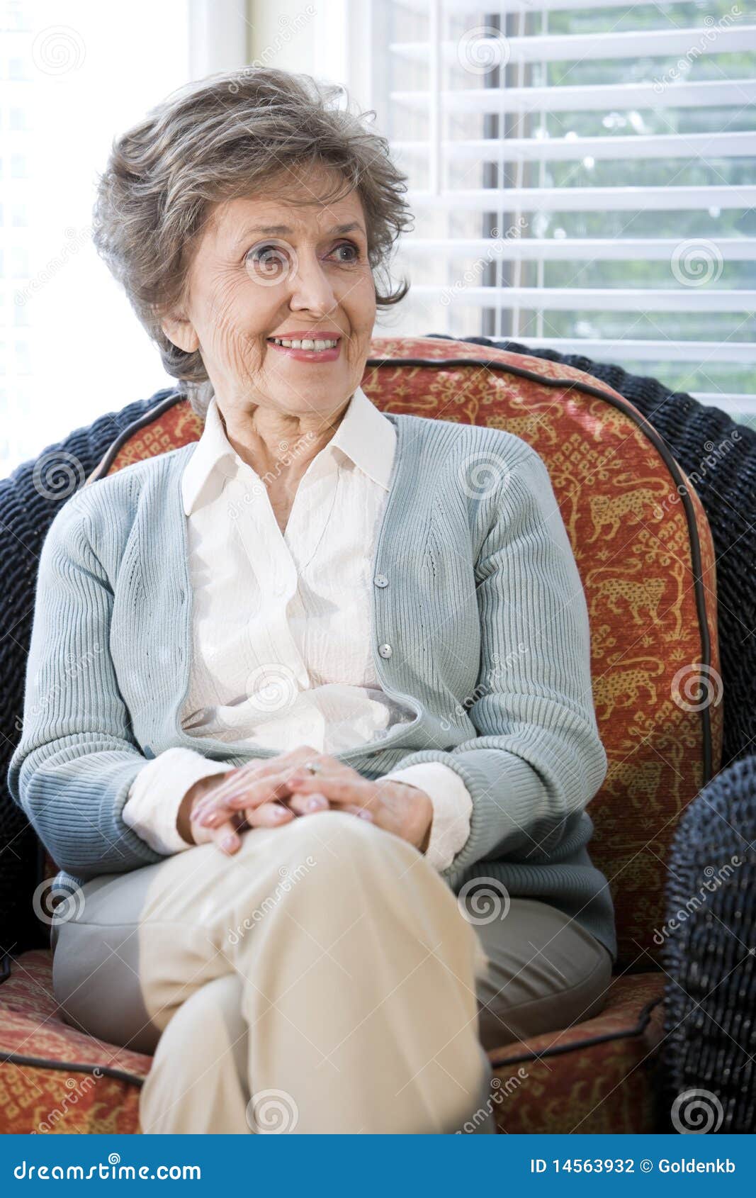 Senior Woman Sitting On Living Room Chair Stock Photography - Image