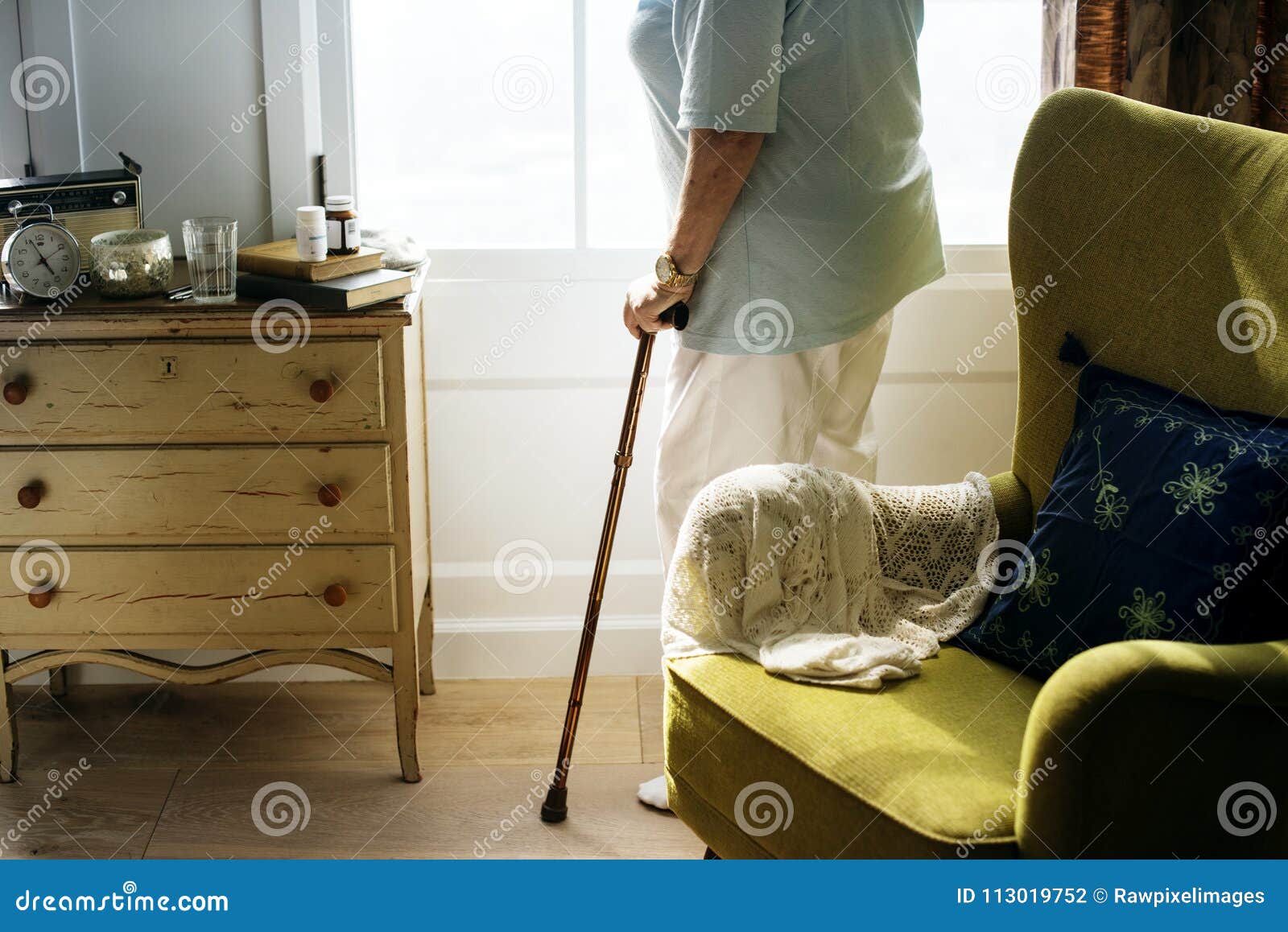 senior woman standing alone in the room