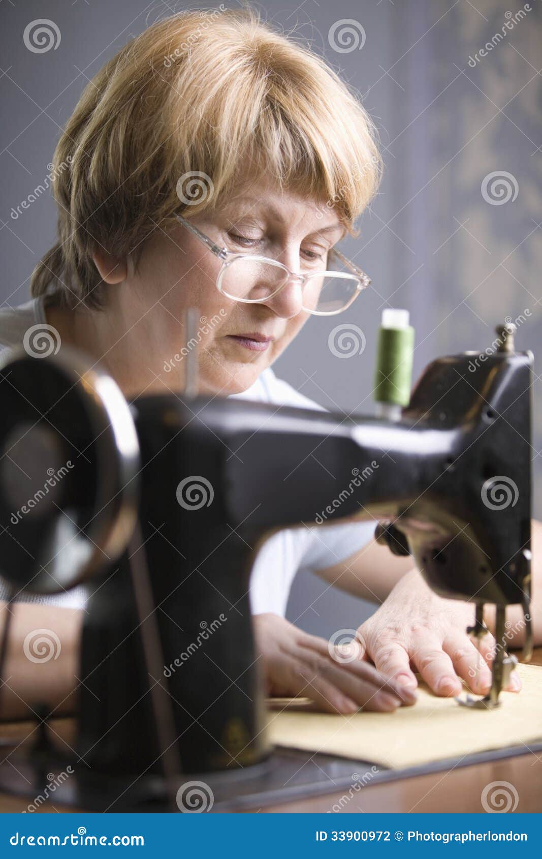 Senior Woman Using Sewing Machine Stock Photo Image of retired