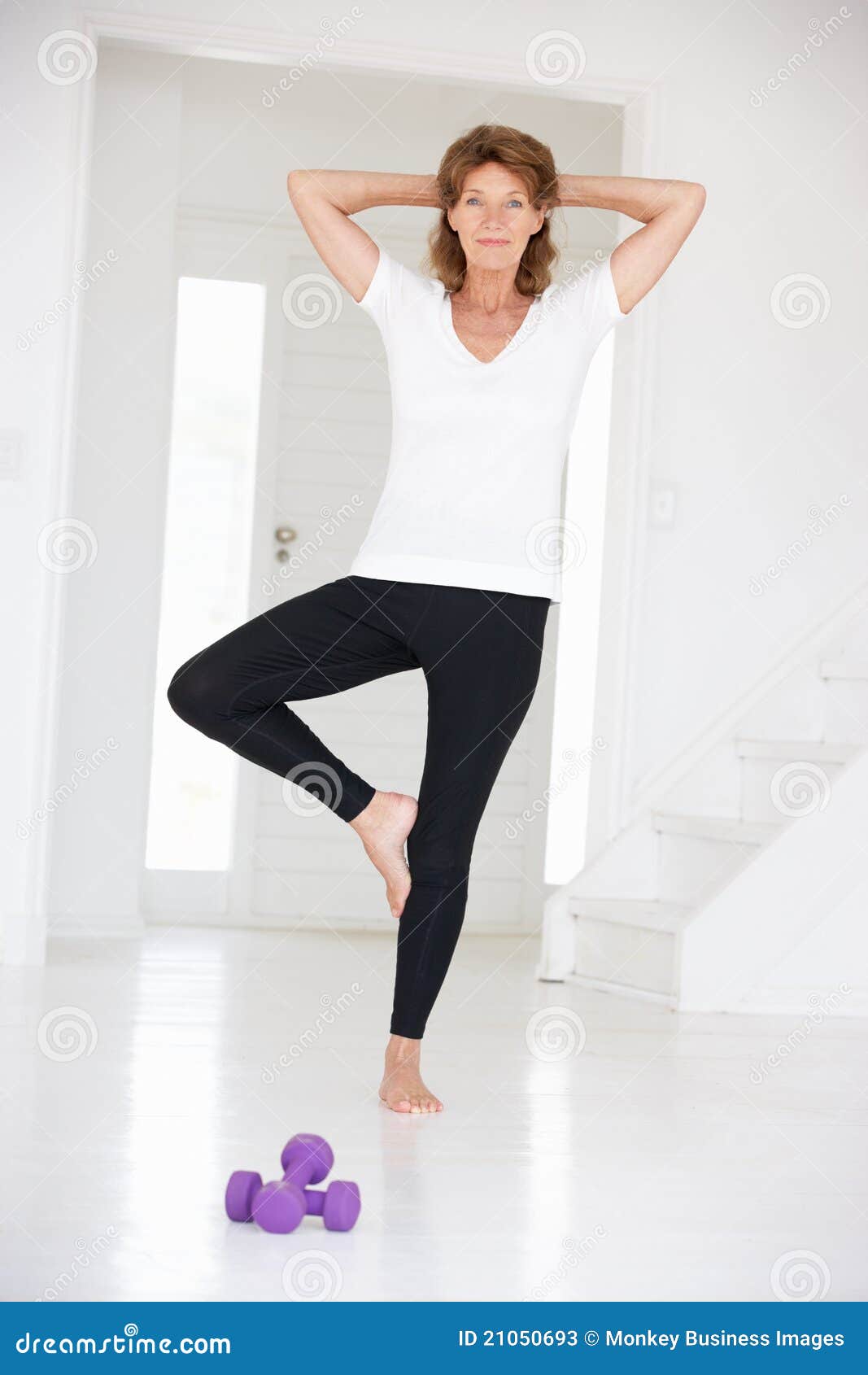 Smiling women training yoga positions in modern - Stock Photo  [100665919] - PIXTA