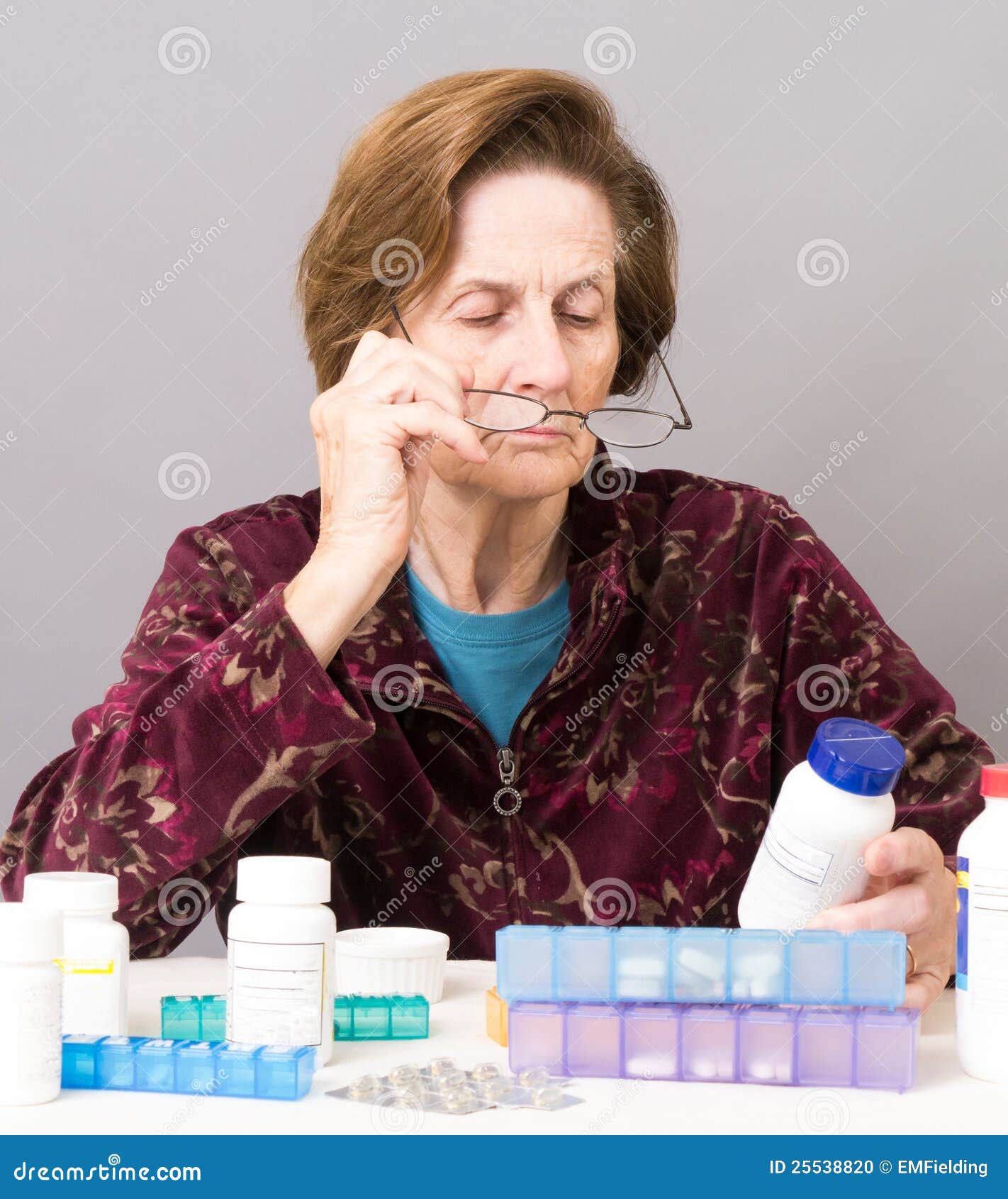 senior women managing her medication