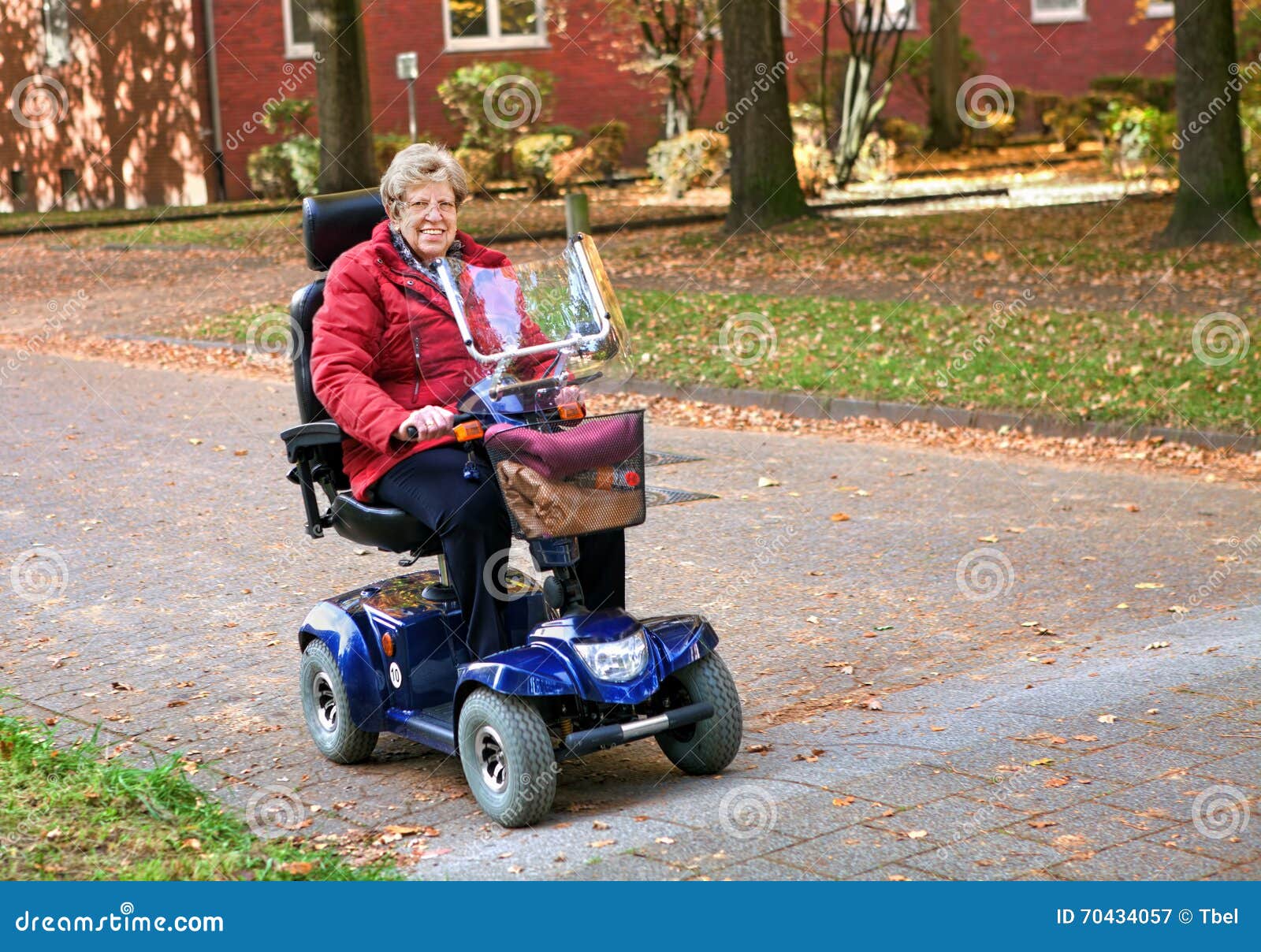 seniorin with electric scooter