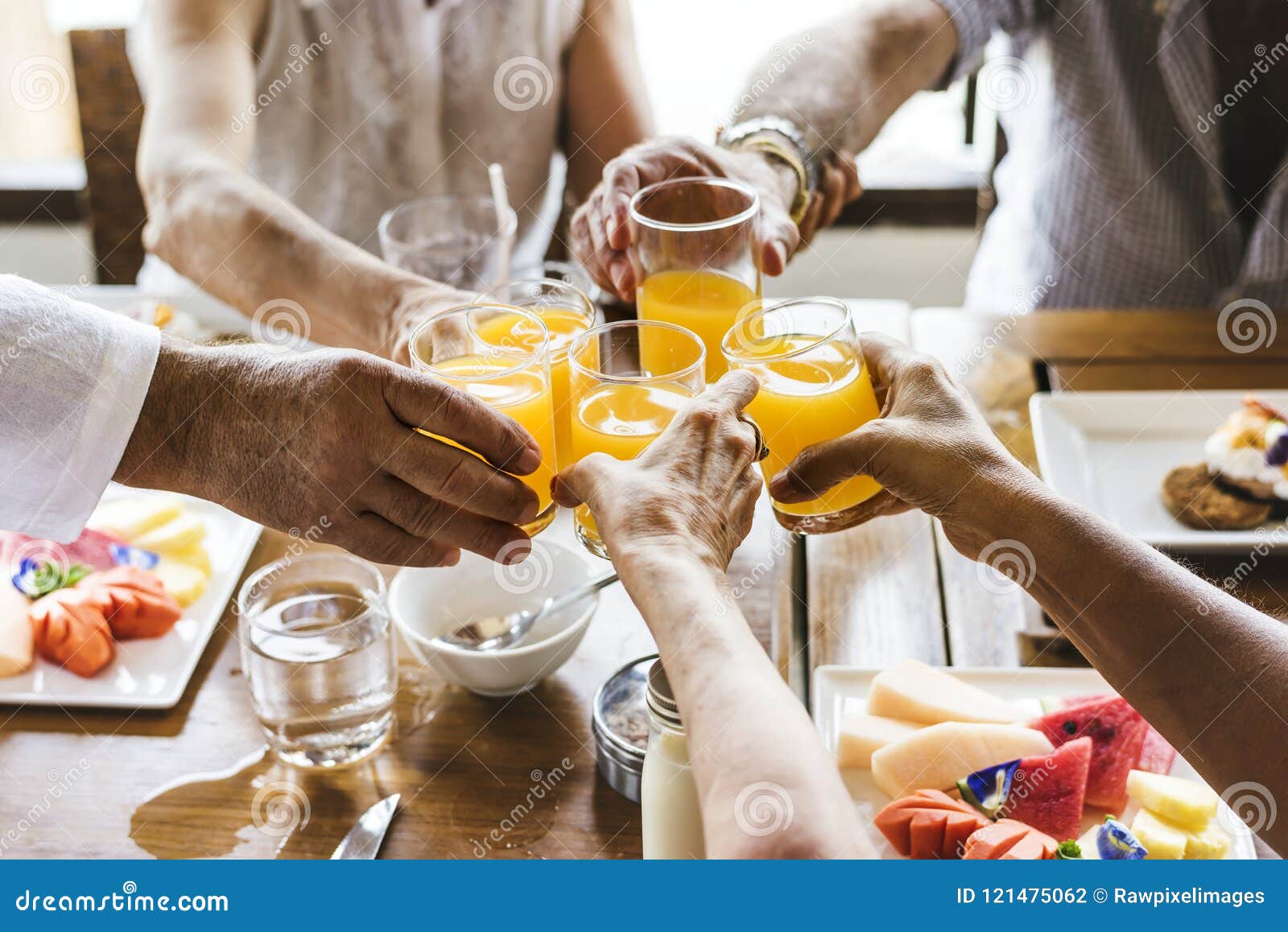 seniors enjoying breakfast in hotel