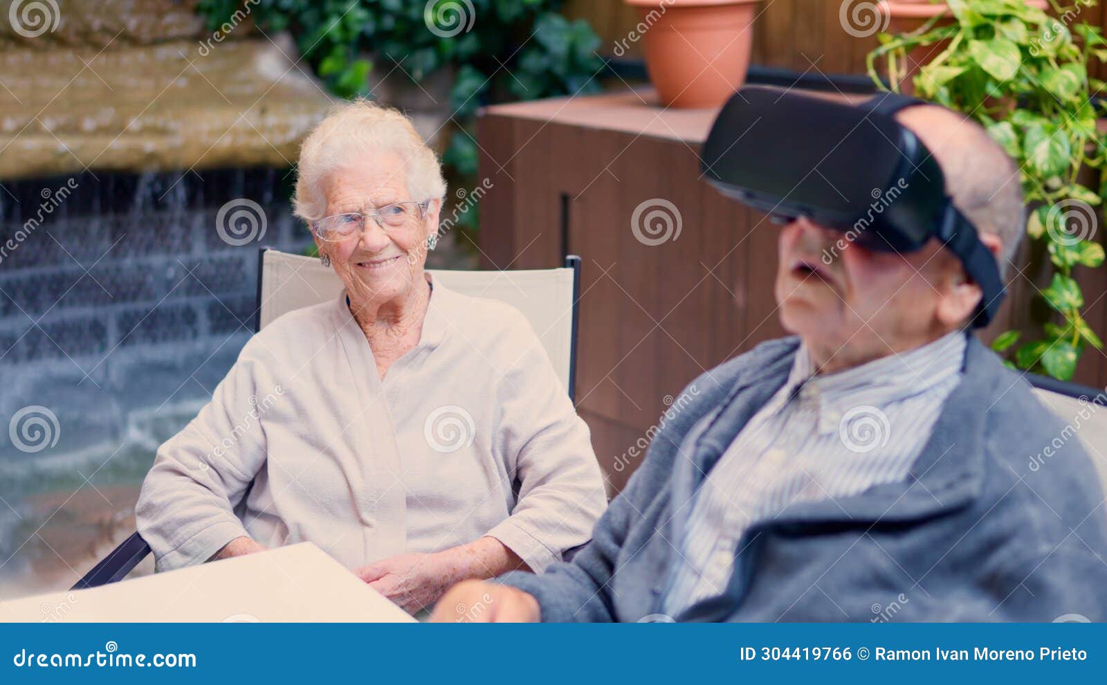 Seniors Having Fun while Using Virtual Reality Goggles Stock Photo