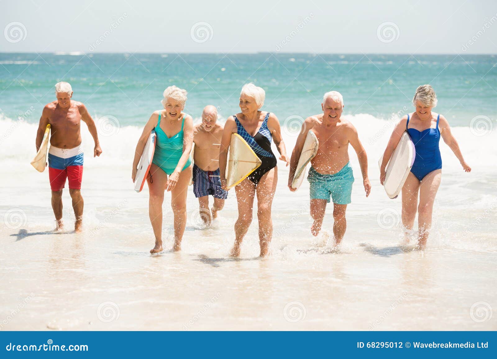 Seniors Holding Surfboards at the Beach Stock Photo Image of