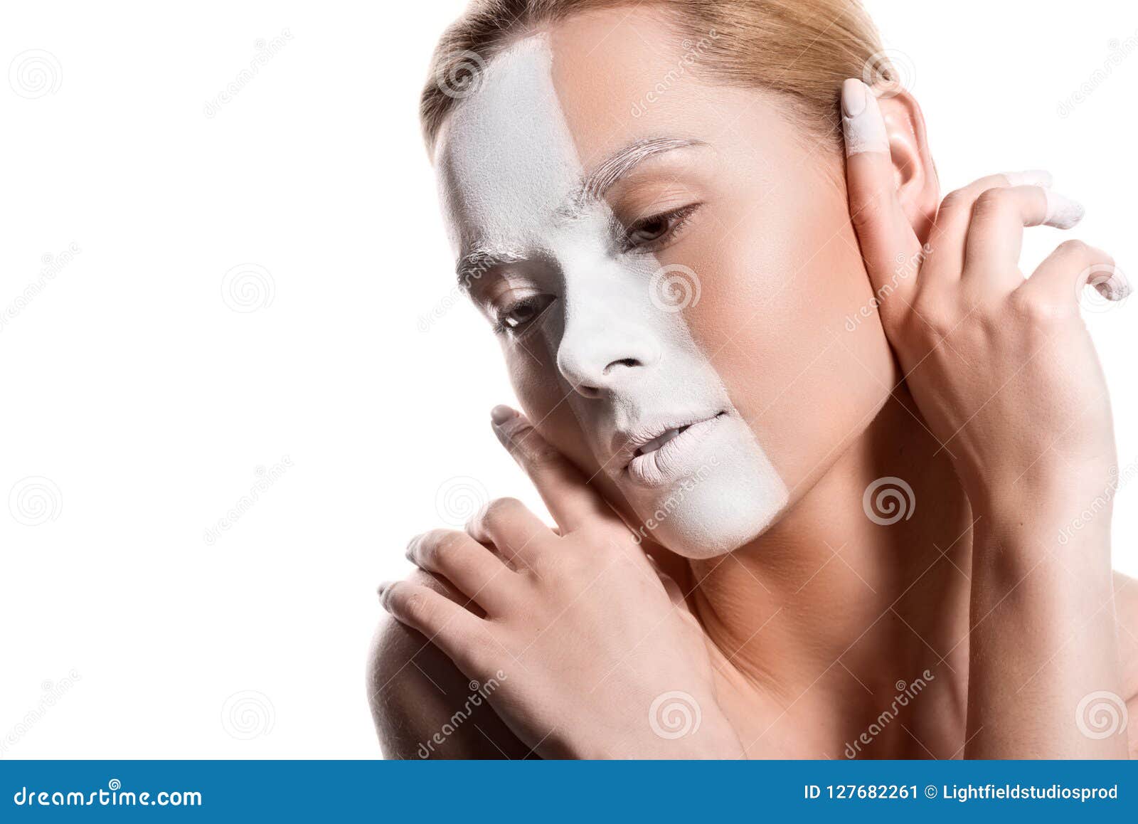 sensual beautiful woman with white paint on face