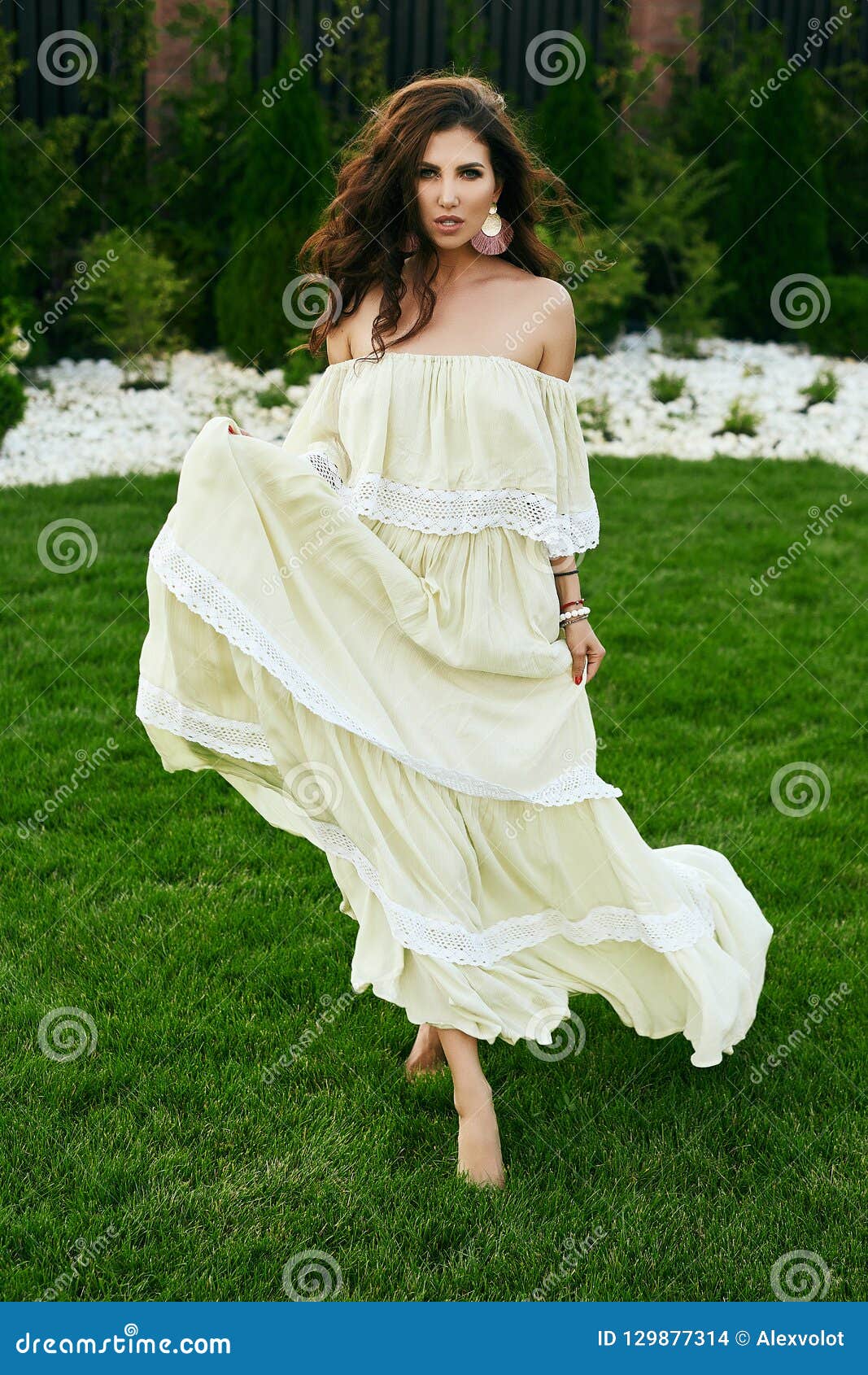 Sensual Brunette Model in Fashion Dress Posing in Garden Stock Photo ...