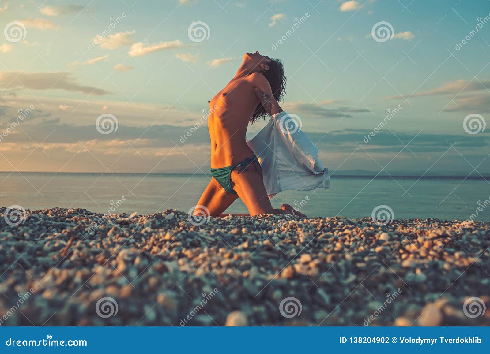 girl laying naked in beach