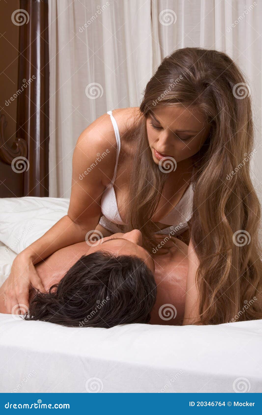 Sensual Heterosexual Couple in Lingerie on Bed Stock Photo picture