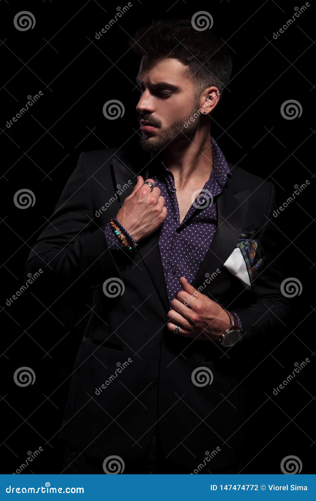 Sensual Man Looking To the Side and Adjusting His Jacket Stock Photo ...