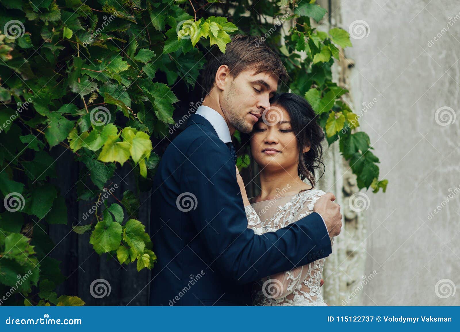 https://thumbs.dreamstime.com/z/sensual-married-couple-valentines-hugging-front-old-slavi-portrait-elegant-asian-bride-hugging-groom-115122737.jpg