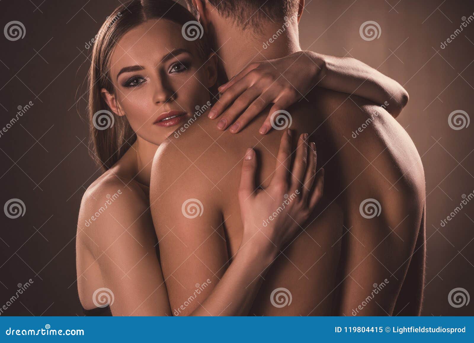 sensual nude lovers hugging,
