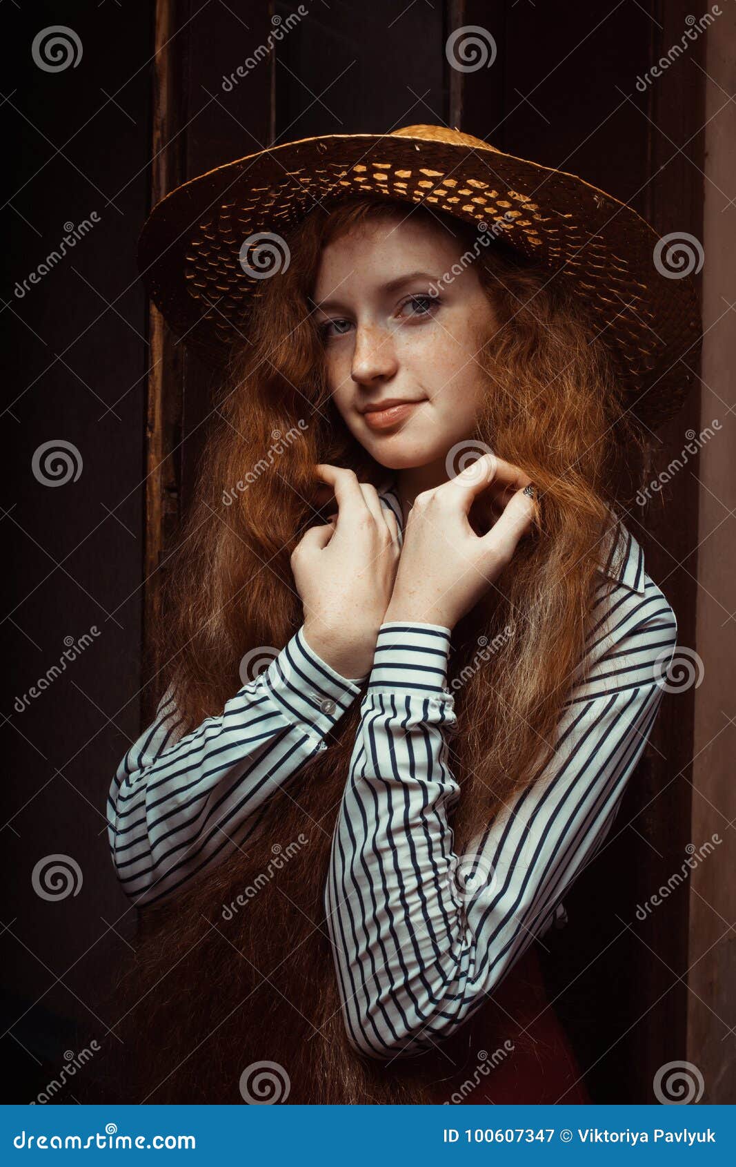 Sensual Redhead Model With Long Curly Hair In Straw Hat