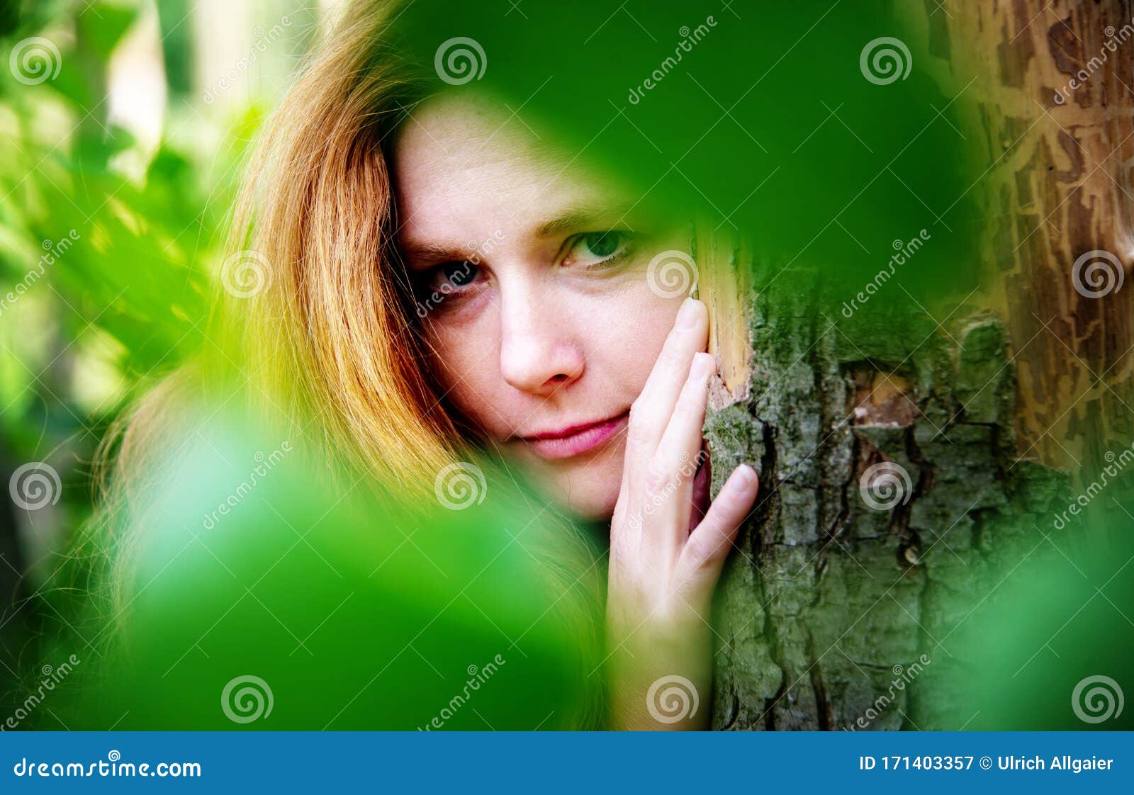 Sensual Portrait of Beautiful Red-haired Woman Outdoors Under the Trees ...