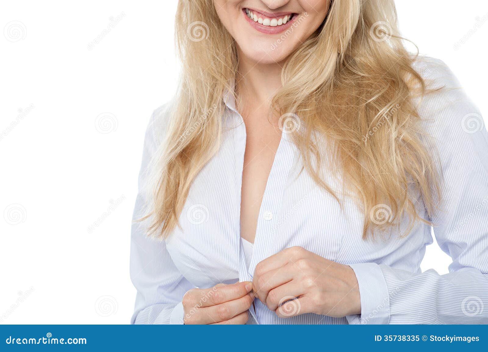Photo about Cropped image of a woman taking off her shirt. 