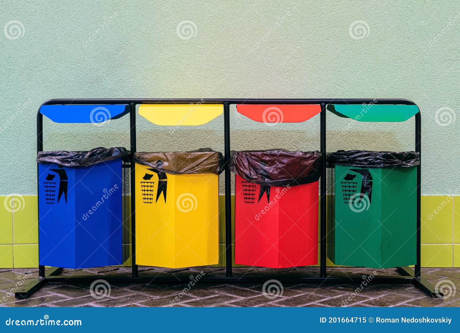 Separate Collection of Glass, Metal, Paper and Plastic. Colored Bins