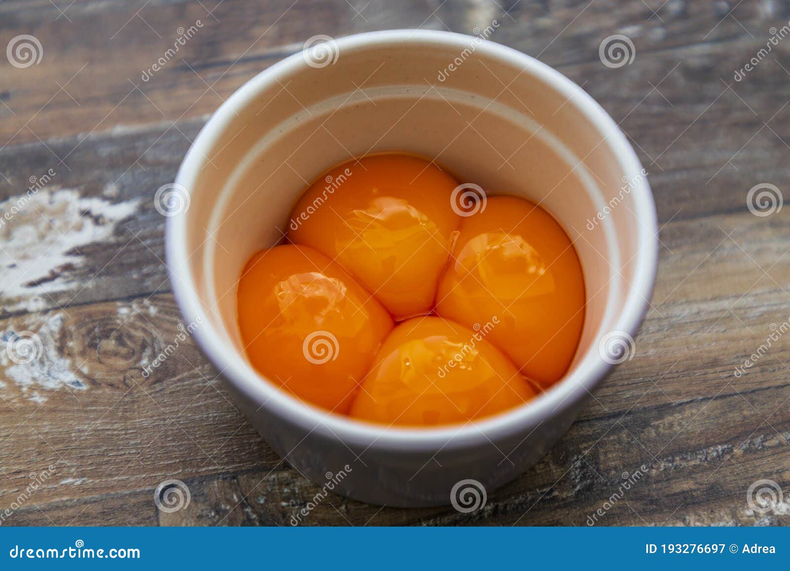 separated yolks from albumen in a small bole