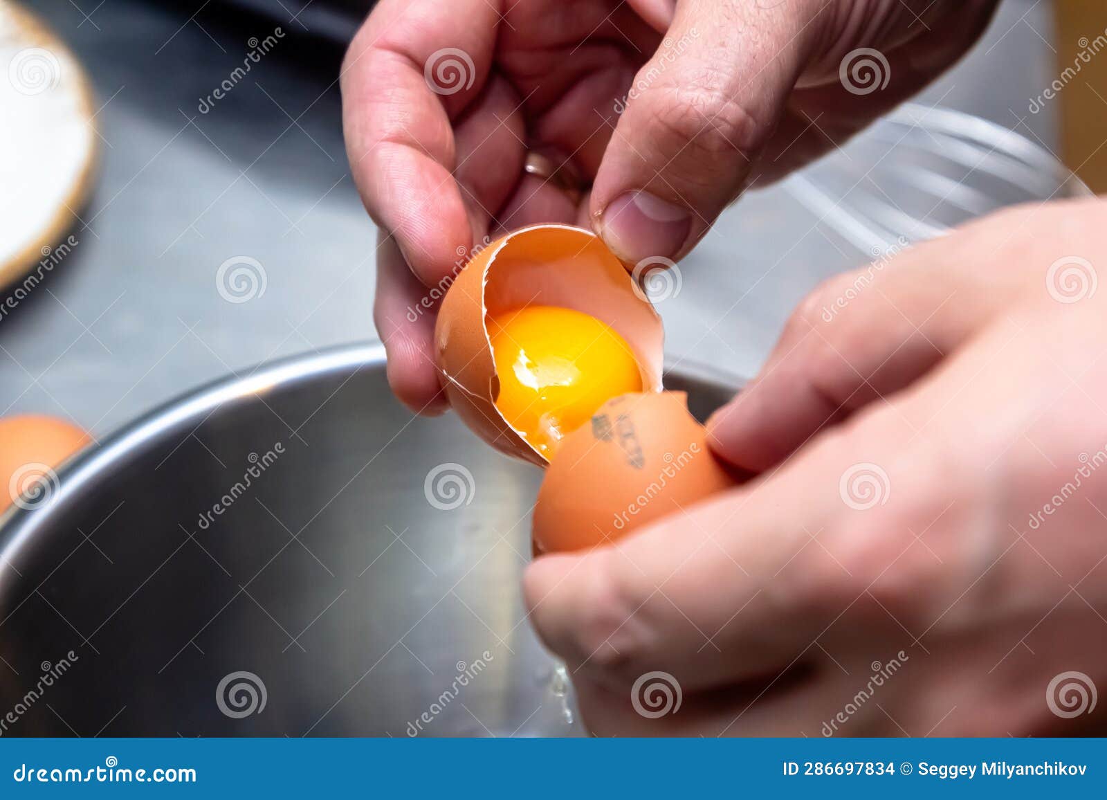 Separate The Egg Yolks From The Egg Whites Prepared For Making Cakes