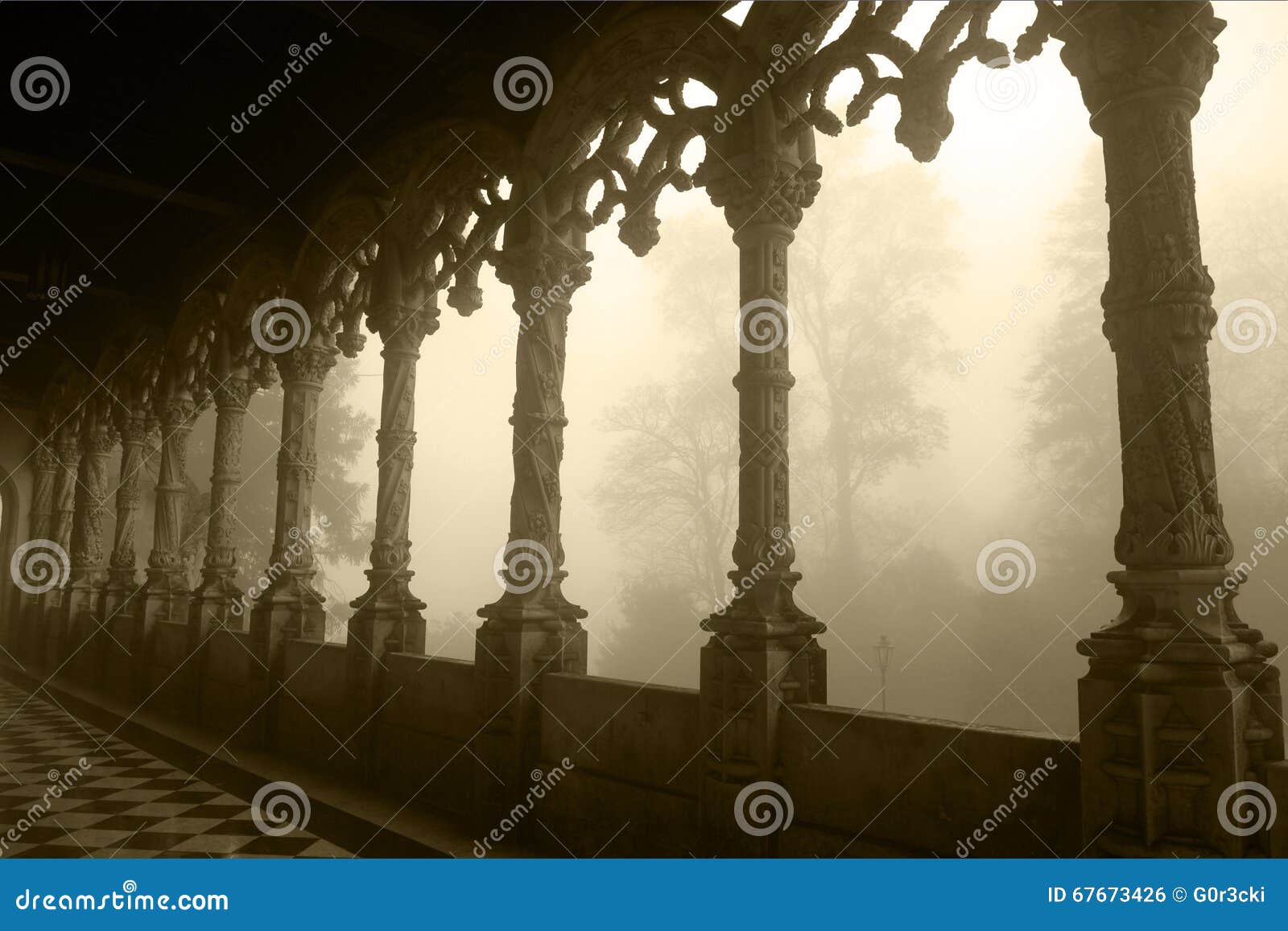 portugal - bussaco palace arched gallery, tracery , foggy day - sepia image