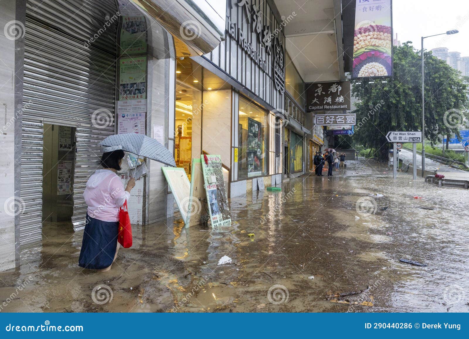 After Heavy Rain in Hong Kong, Citizens Walk in Muddy Water on the ...