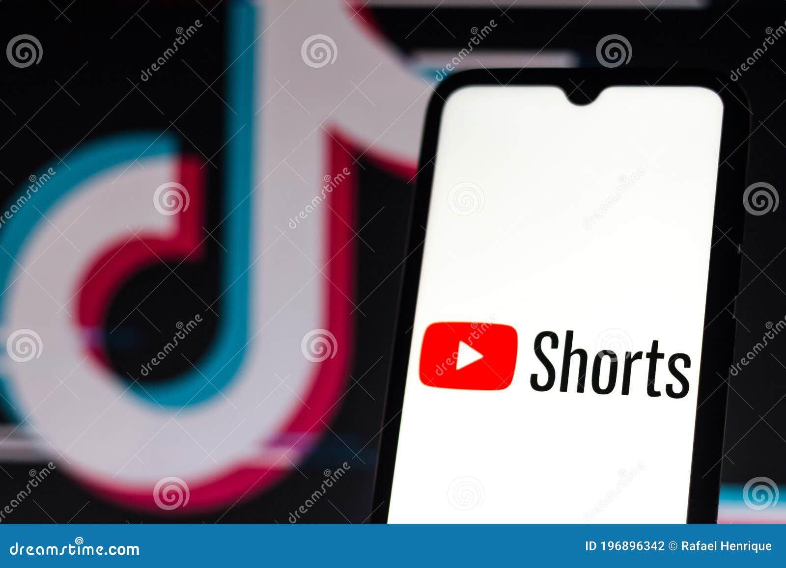September 21, 2020, Brazil. In this photo illustration a YouTube Shorts logo is seen displayed on a smartphone with an TikTok logo on the background.