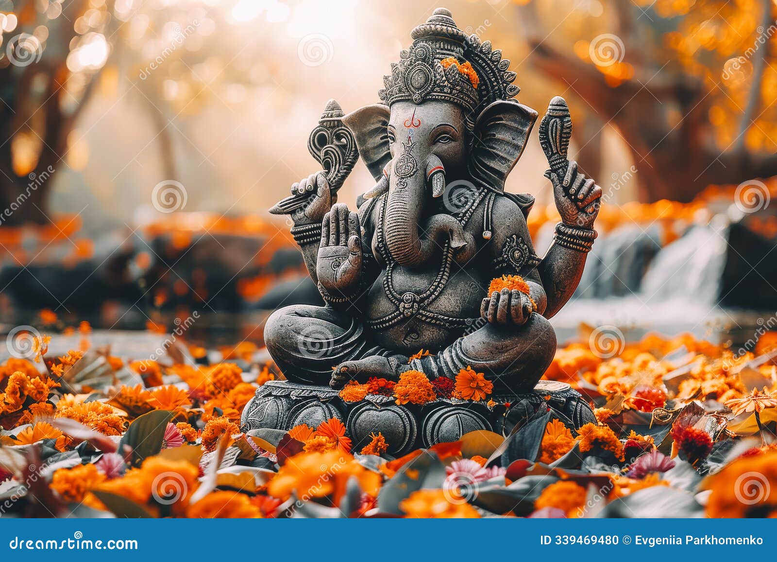 serene ganesha statuette surrounded by autumn leaves and warm glow