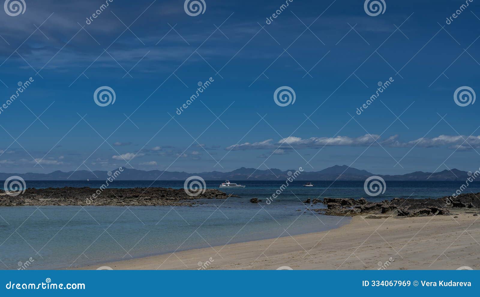 a serene seascape. boats in the turquoise ocean.