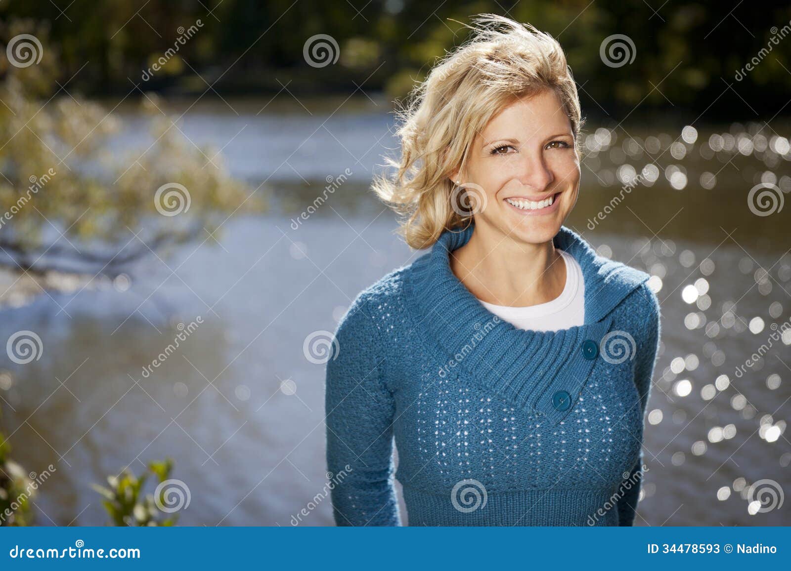 serene woman smiling at the park