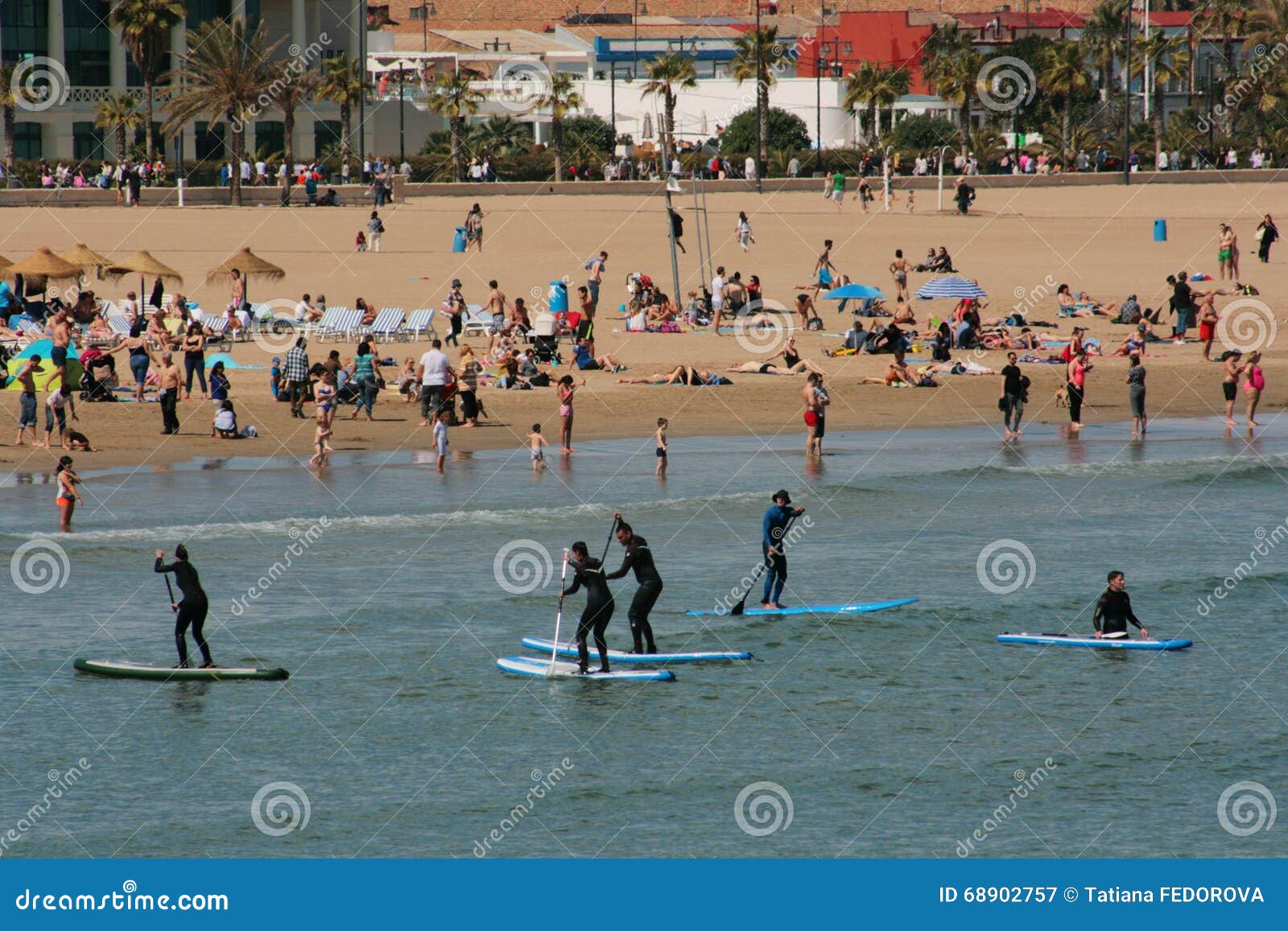 serfing-group-in-mediterranean-waters-of-valencia-spain-editorial