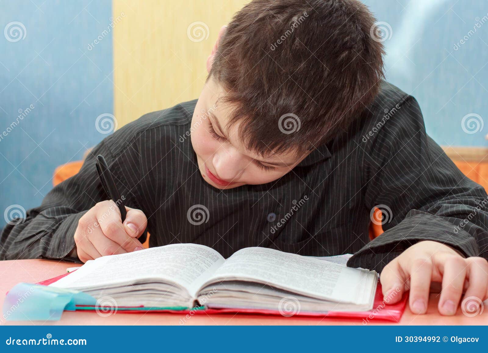 serios boy doing lessons