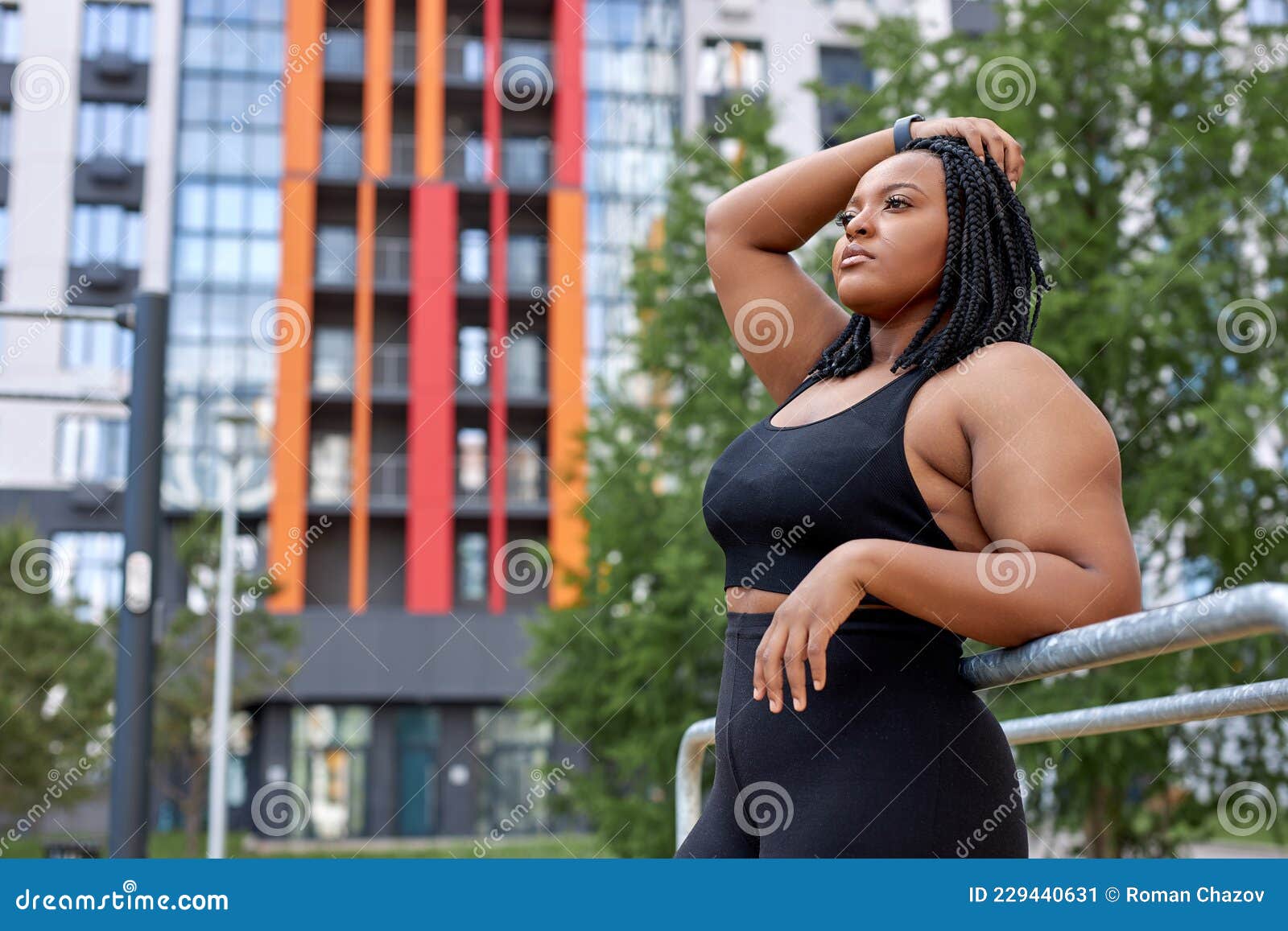 Serious Afro American Lady Posing Looking at Side Outdoors, in