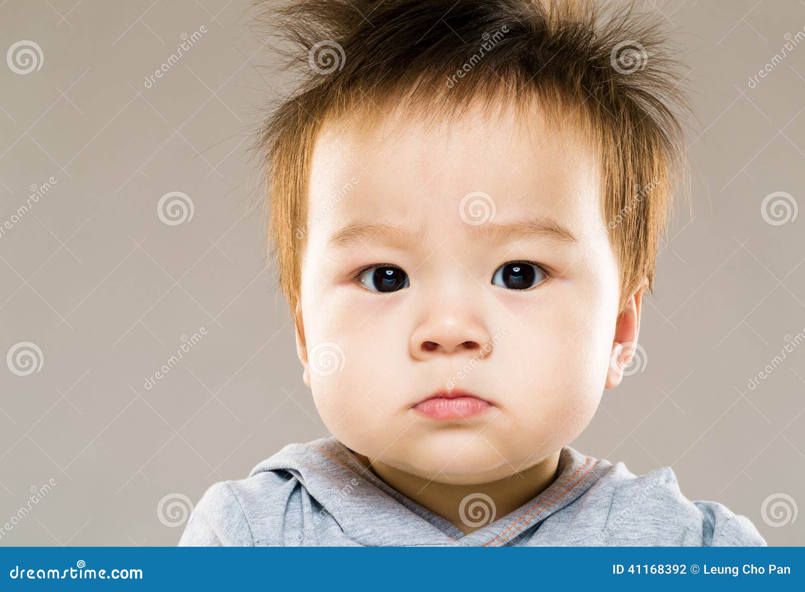 Serious baby boy stock photo. Image of cute, person, finger 41168392