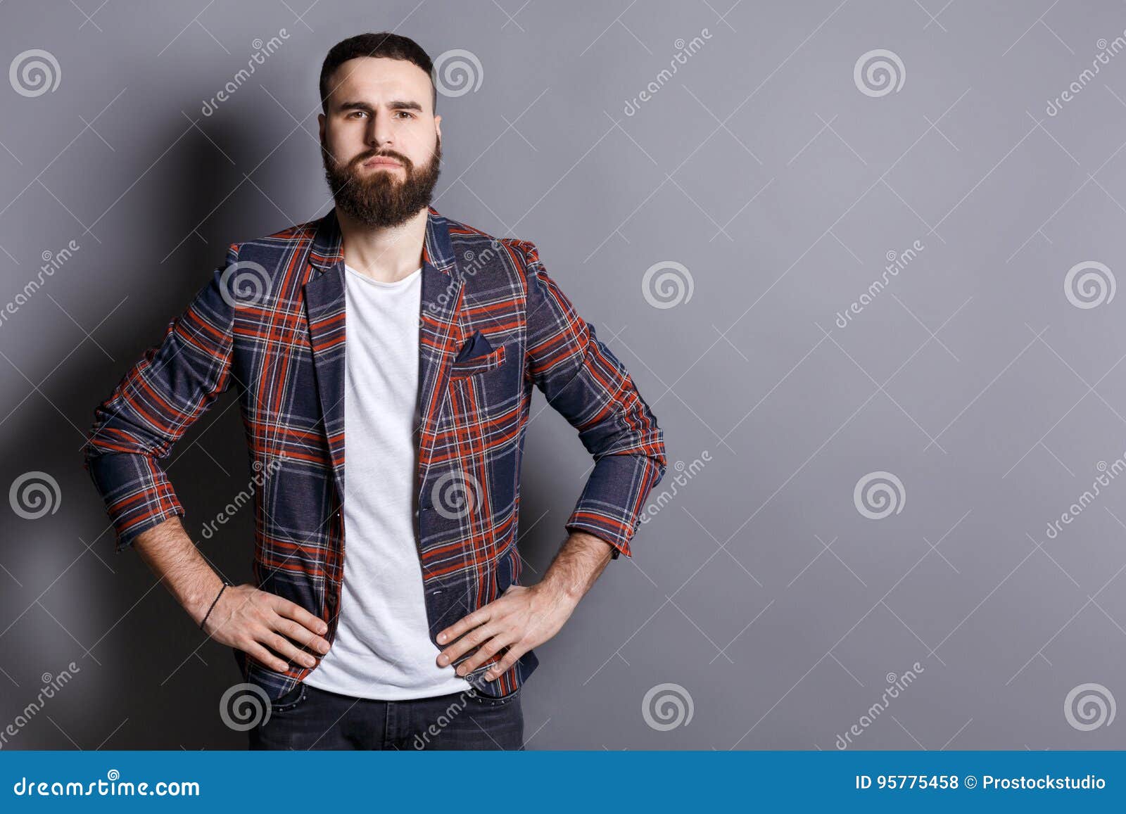 Serious Bearded Man Posing with Hands on Hips Stock Photo - Image of ...