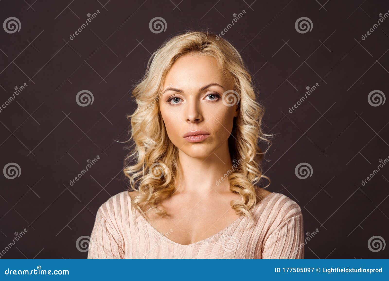 Serious Blonde Woman with Hair in Bun - wide 2