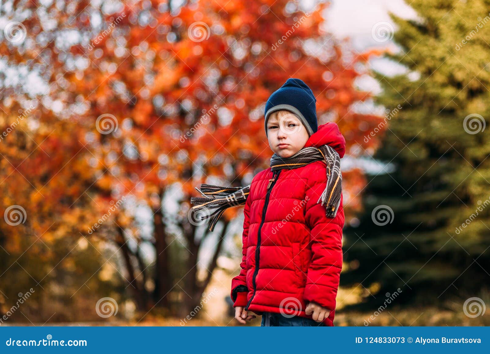 Serious Boy in a Red Jacket Outdoors Stock Image Image of background