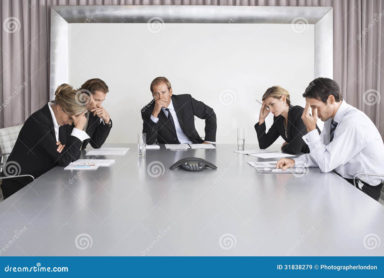 Serious Business People on Conference Call Stock Image - Image of