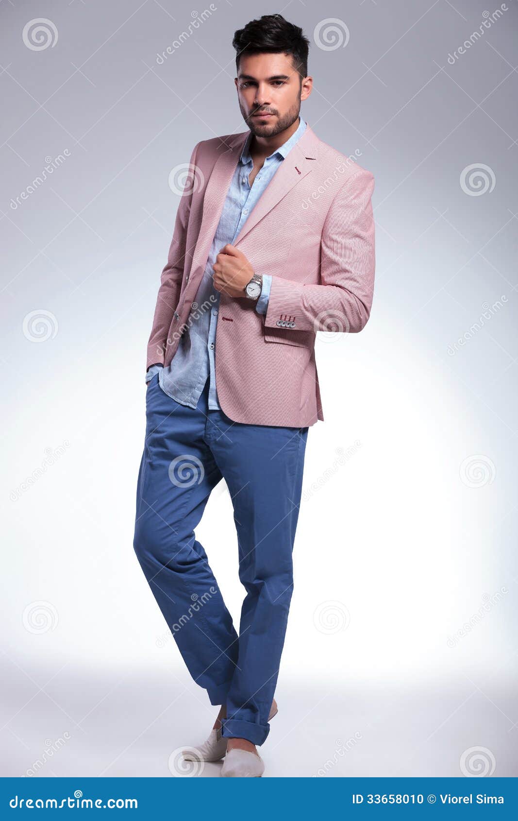 Serious Casual Man with Hand on Jacket Stock Photo - Image of hand ...