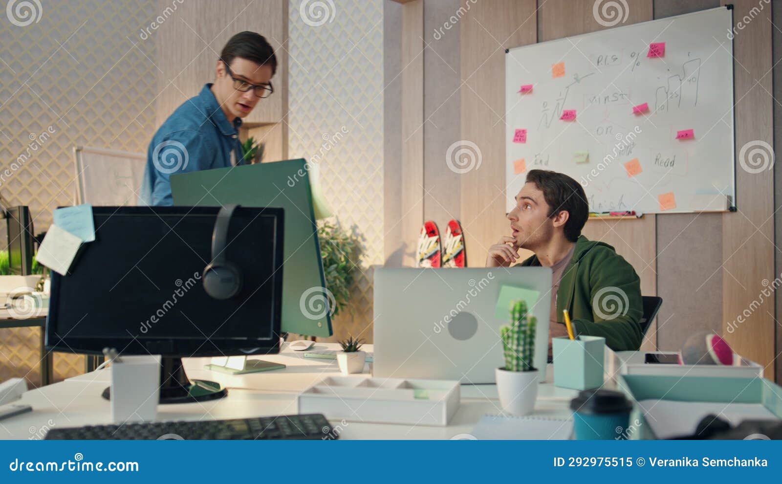 serious colleagues working computer checking project results. team work together