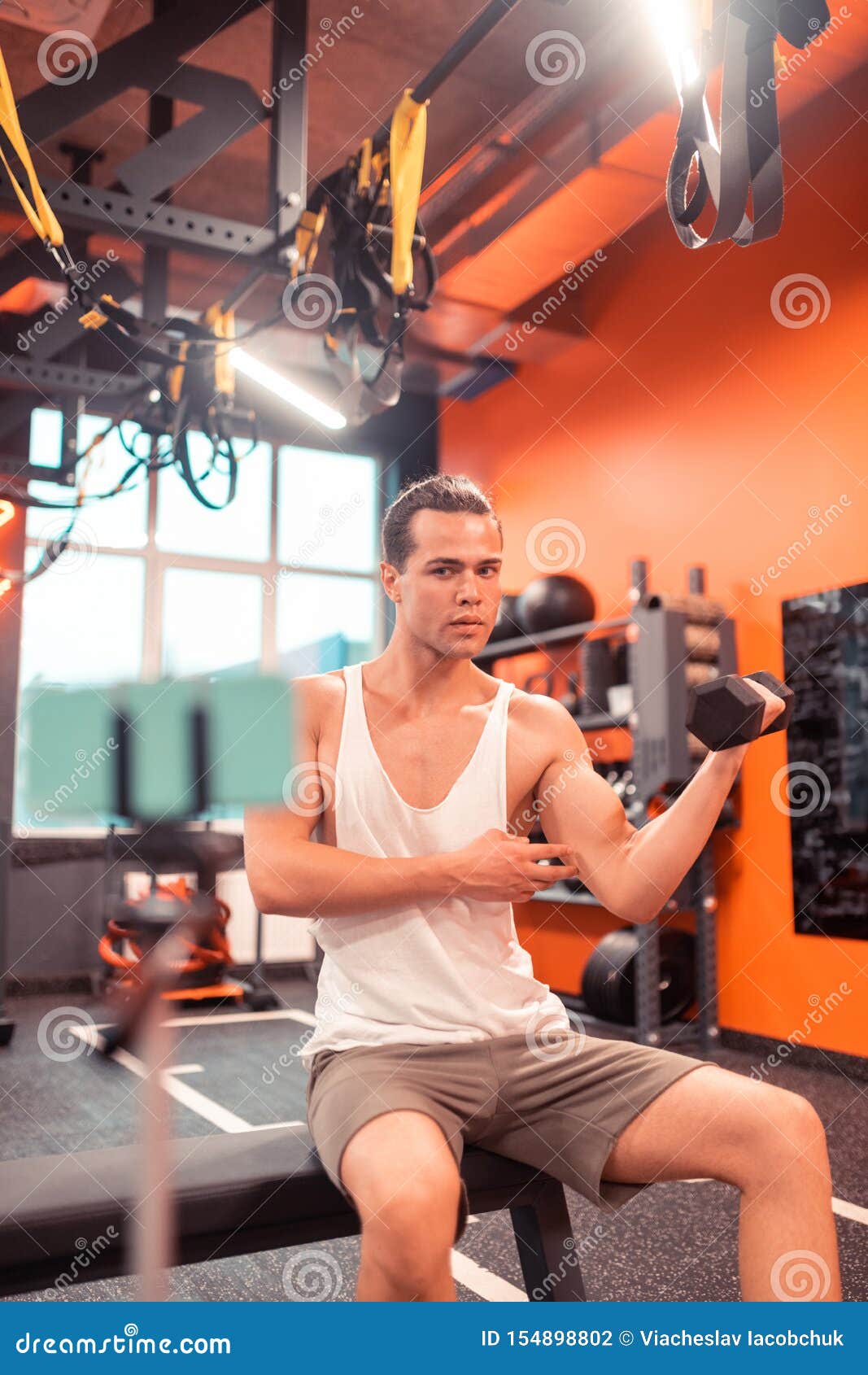 serious fit man having a tutorial online